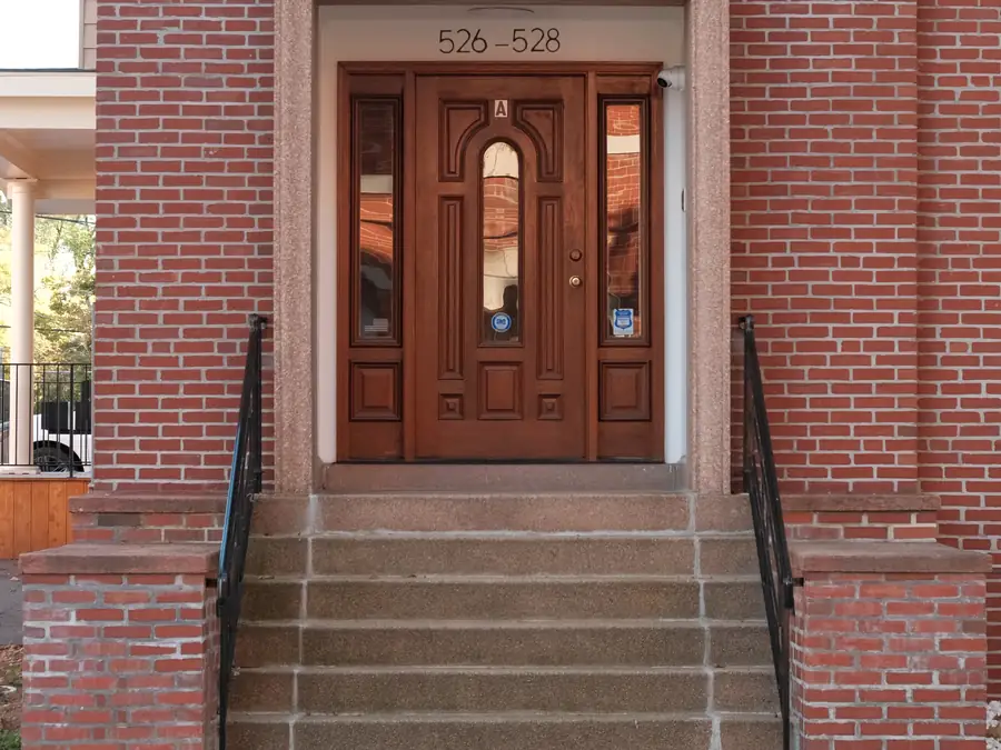 The front door of 528 Chapel Street, up a short flight of steps